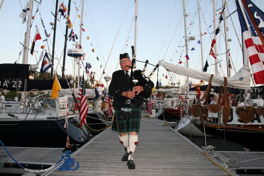 David Frith Pipe Major of the Bermuda Islands Pipe Band plays the pipes and walks the docks as part of the traditional sunset ceremony at the Royal Hamilton Amateur Dinghy Club. Â©SpectrumPhoto/Fran Grenon © Fran Grenon Spectrum Photos